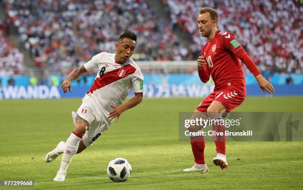 Christian Cueva of Peru in action with Christian Eriksen of Denmark during the 2018 FIFA World Cup Russia group C match between Peru and Denmark at...