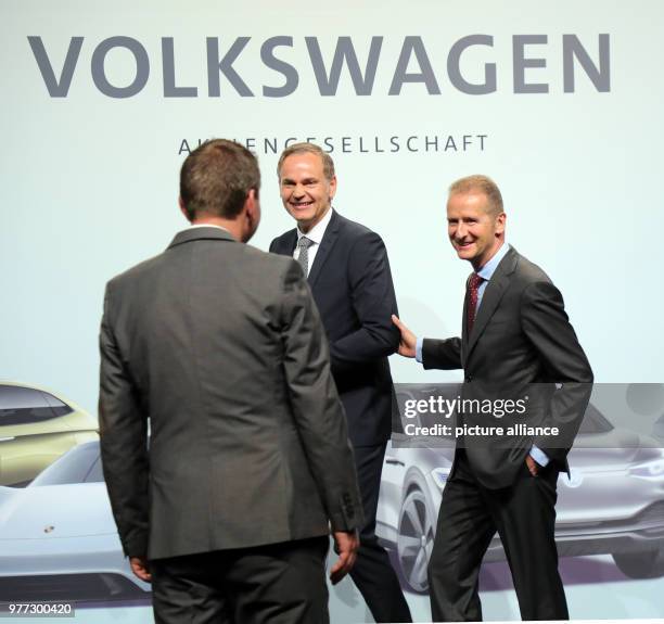 May 2018, Germany, Berlin: Herbert Diess, CEO of Volkswagen AG and Oliver Blume, CEO of Porsche AG, in conversation at the Volkswagen AG annual...