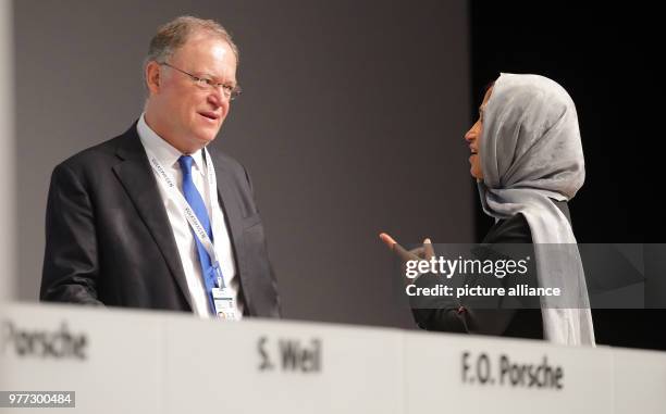 May 2018, Germany, Berlin: Stefan Weil of the Social Democratic Party and Premier of Lower Saxony, in conversation with Hessa Sultan Al Jaber,...