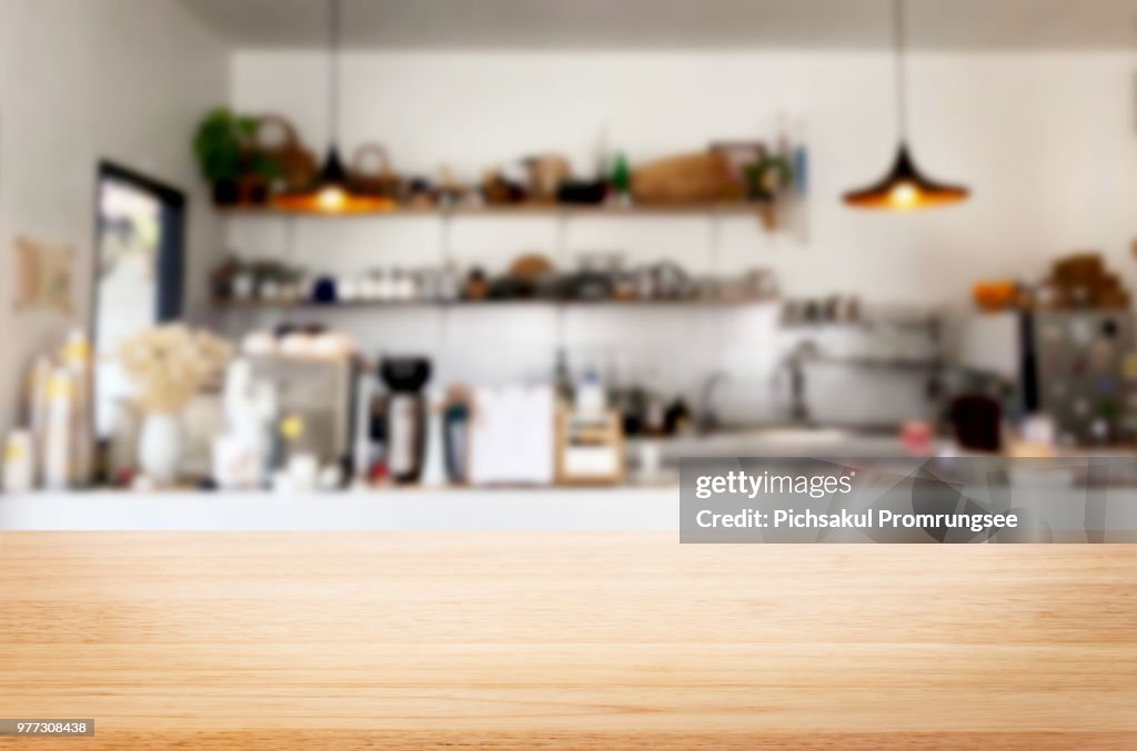 Close-Up Of Wooden Table Against Kitchen