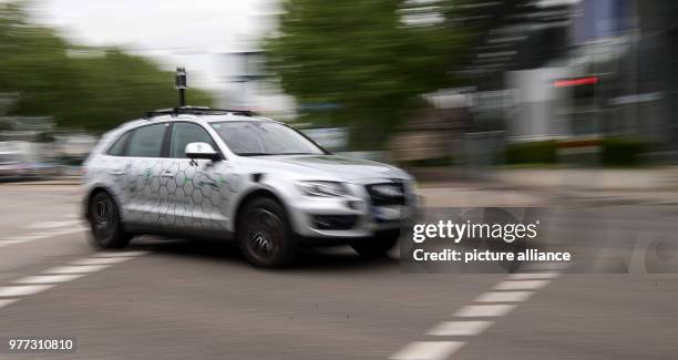 May 2018, Germany, Karlsruhe: An autonomous vehicle of the research centre Informatik is on the road during the opening of the 'Testfelds Autonomes...