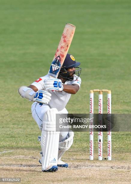 Niroshan Dickwella of Sri Lanka hits 4 during day 4 of the 2nd Test between West Indies and Sri Lanka at Daren Sammy Cricket Ground, Gros Islet, St....