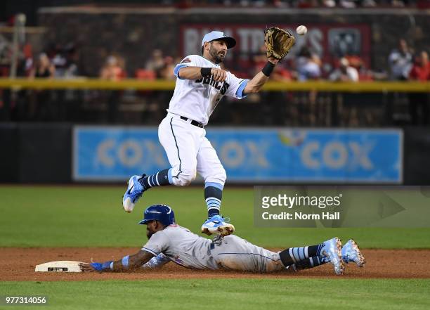 Jose Reyes of the New York Mets safely steals second base as Daniel Descalso of the Arizona Diamondbacks makes a leaping catch on a hight throw from...