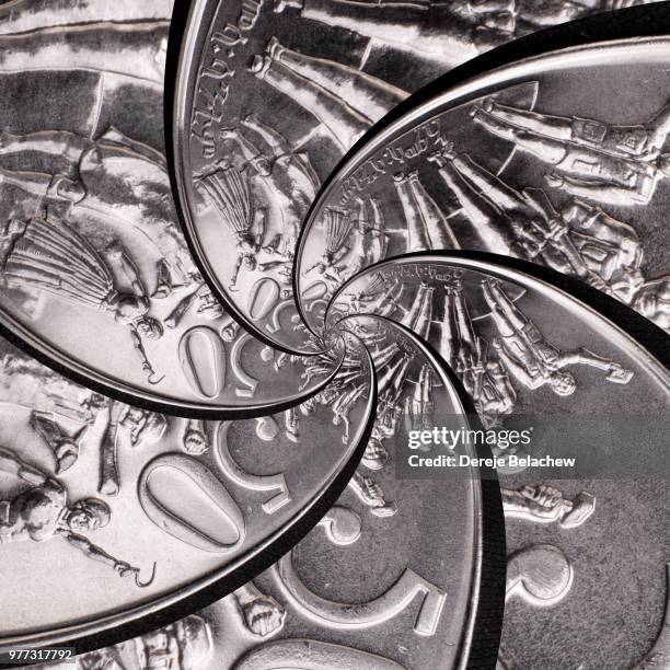 spinning coin - spinning coin stock pictures, royalty-free photos & images