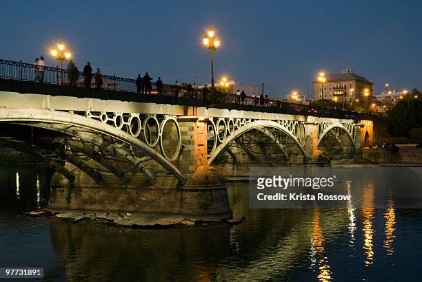 seville, andalusia, spain, el puente de triana - krista rossow stock pictures, royalty-free photos & images