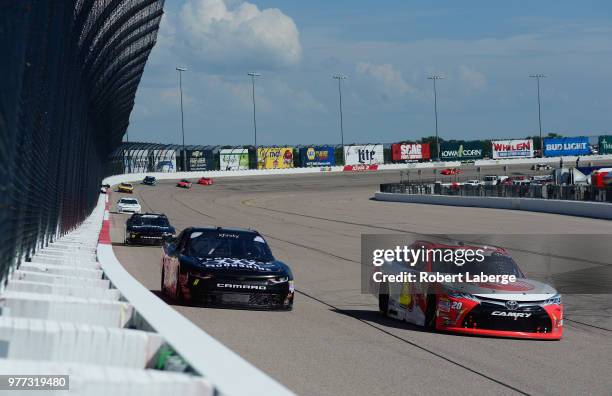 Christopher Bell, driver of the Rheem Toyota, leads a pack of cars during the NASCAR Xfinity Series Iowa 250 presented by Enogen at Iowa Speedway on...