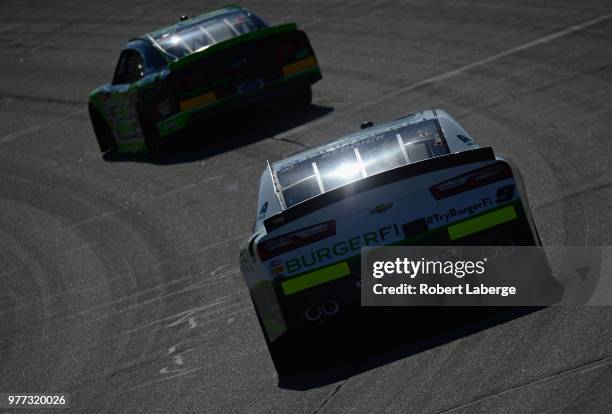 Tyler Reddick, driver of the BurgerFi Chevrolet, races during the NASCAR Xfinity Series Iowa 250 presented by Enogen at Iowa Speedway on June 17,...