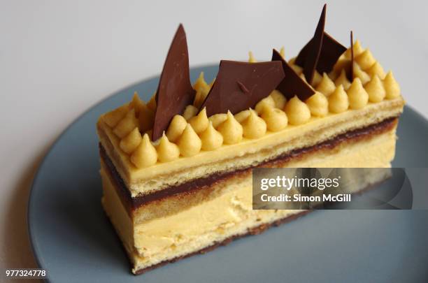 slice of opera cake - opera cake stock pictures, royalty-free photos & images