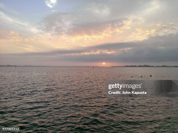 sunset at cape coral yacht club beach 1 - cape coral stockfoto's en -beelden