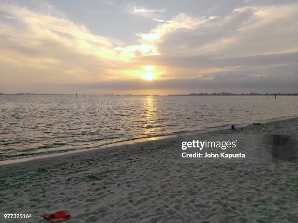 sunset at cape coral yacht club beach - cape coral stockfoto's en -beelden