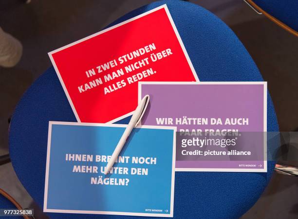 May 2018, Germany, Bautzen: Survey papers lie on a table at an event hosted by Saxony's Economic Minister Martin Dulig of the Social Democratic Party...