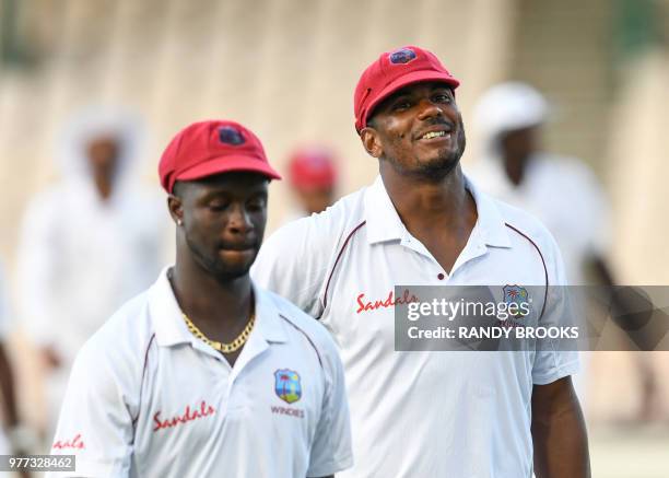 Shannon Gabriel and Kemar Roach of West Indies at the end of day 4 of the 2nd Test between West Indies and Sri Lanka at Daren Sammy Cricket Ground,...