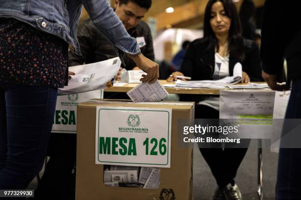 Voter casts a ballot inside the Corferias polling station during the second round of presidential elections in Bogota, Colombia, on Sunday, June 17,...