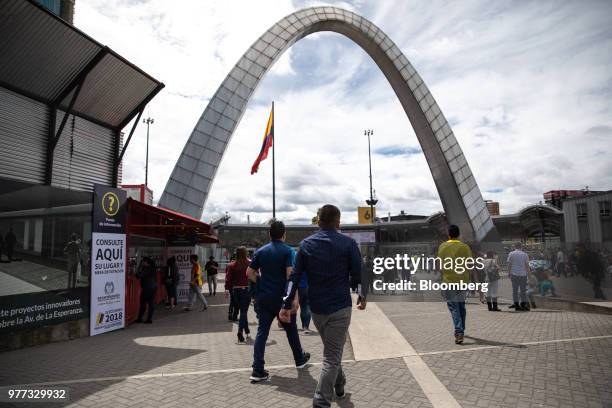 Voters walk towards the Corferias polling station during the second round of presidential elections in Bogota, Colombia, on Sunday, June 17, 2018....