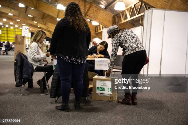 Voter casts a ballot inside the Corferias polling station during the second round of presidential elections in Bogota, Colombia, on Sunday, June 17,...