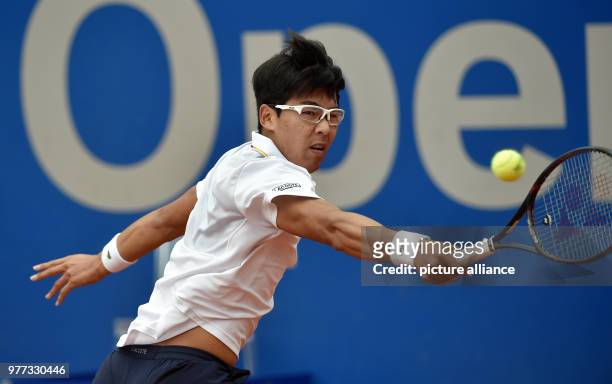 South Korean tennis player Chung Hyeon returns to the Slovakian Martin Klizan during their 2018 BMW Open men's singles quarter-finals match in...