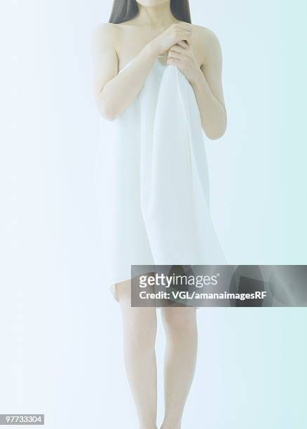 woman wrapped in a white towel - asian pin up girls stock-fotos und bilder