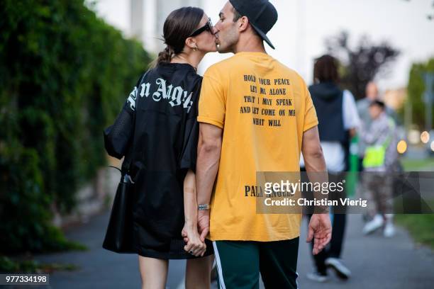 Couple kissing each other seen outside Palm Angels during Milan Men's Fashion Week Spring/Summer 2019 on June 17, 2018 in Milan, Italy.