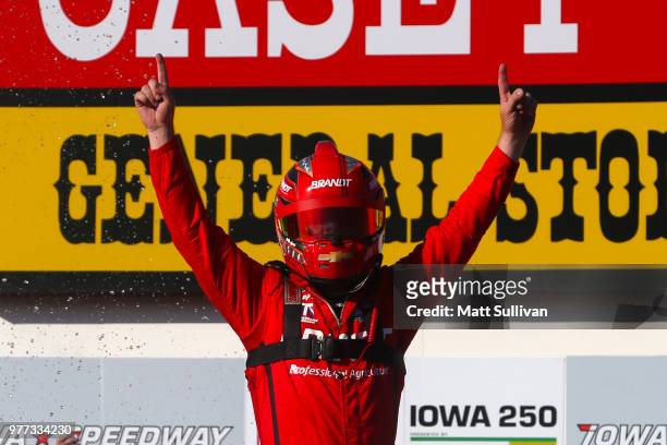 Justin Allgaier, driver of the BRANDT Professional Agriculture Chevrolet, celebrates in victory lave after winning the NASCAR Xfinity Series Iowa 250...