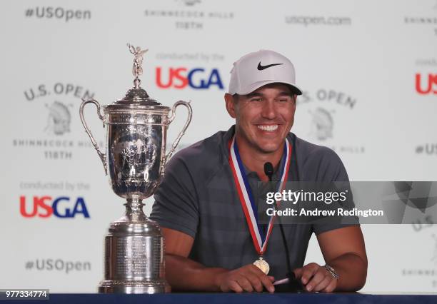 Brooks Koepka of the United States speaks to the media after winning the 2018 U.S. Open at Shinnecock Hills Golf Club on June 17, 2018 in...