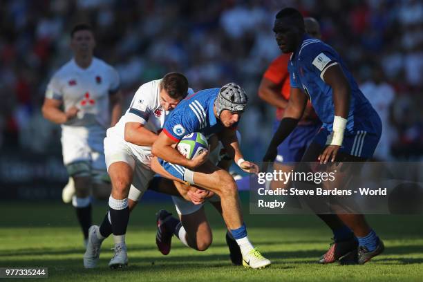 Clement Laporte of France is tackled by Tom Parton of England during the World Rugby via Getty Images Under 20 Championship Final between England and...