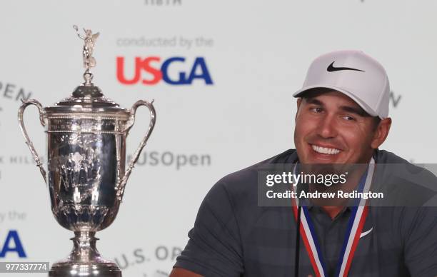 Brooks Koepka of the United States speaks to the media after winning the 2018 U.S. Open at Shinnecock Hills Golf Club on June 17, 2018 in...