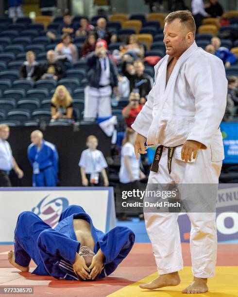 Christophe Fouache of France reacts after being thrown by Thomas Freese of Germany for an ippon to finish Germany's five contests with five ippons...