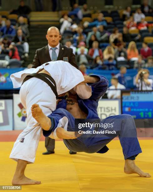 Marcus Utzat of Germany throws Franck Chazeirat of France for an ippon to help Germany to a 5/0 defeat of France in their M4 quarter-final match...