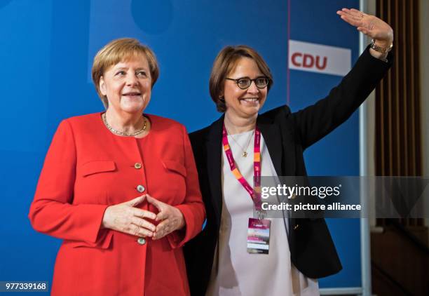 Dpatop - German Chancellor Angela Merkel and Frauen Union chairwoman Annette Widmann-Mauz attend a ceremony celebrating the 70th anniversary of the...