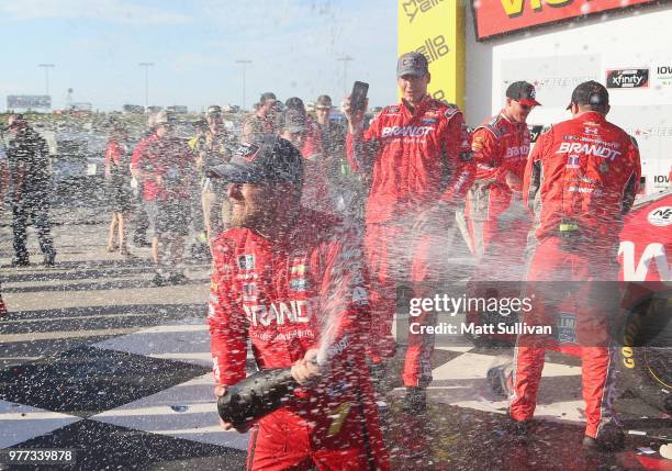 Justin Allgaier, driver of the BRANDT Professional Agriculture Chevrolet, celebrates with his crew after winning the NASCAR Xfinity Series Iowa 250...