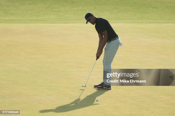 Tony Finau of the United States putts on the 18th green during the final round of the 2018 U.S. Open at Shinnecock Hills Golf Club on June 17, 2018...