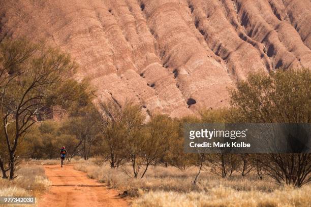 Runner competes during the Uluru Relay Run as part of the National Deadly Fun Run Championships on June 16, 2018 in Uluru, Australia. The annual...