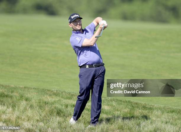 Bfranden Grace of South Africa plays his second shot on the 13th hole during the final round of the 2018 US Open at Shinnecock Hills Golf Club on...