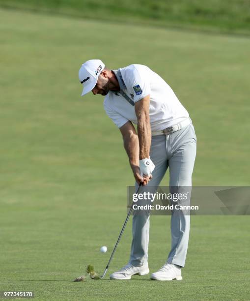 Dustin Johnson of the United States plays his second shot on the 15th hole during the final round of the 2018 US Open at Shinnecock Hills Golf Club...