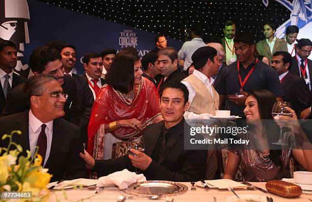 India Today group chairman Aron Purie with actor Aamir Khan and Asin Thottukmal at the dinner party hosted after the India Today Conclave ended in...