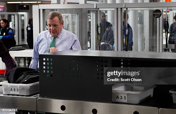 Sen. Dick Durbin passes through a Transportation Security Administration security checkpoint at O'Hare International Airport on March 15, 2010 in...