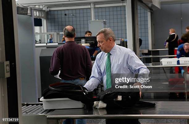 Sen. Dick Durbin passes through a Transportation Security Administration security checkpoint at O'Hare International Airport on March 15, 2010 in...