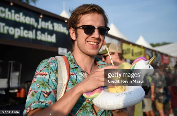 Festivalgoer enjoys a Unicorn Float from Taiyaki NYC during the 2018 Firefly Music Festival on June 17, 2018 in Dover, Delaware.