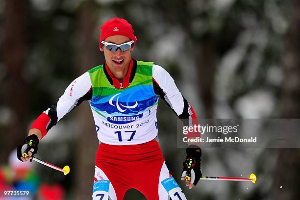 Michael Kurz of Austria smiles as he competes in the men's standing 20km free cross-country skiing race during Day 4 of the 2010 Vancouver Winter...