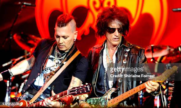 Johnny Depp and Joe Perry of Hollywood Vampires perform at Manchester Arena on June 17, 2018 in Manchester, England.