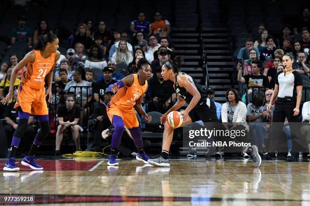 Ja Wilson of the Las Vegas Aces drives against Sancho Lyttle of the Phoenix Mercury on June 17, 2018 at the Mandalay Bay Events Center in Las Vegas,...