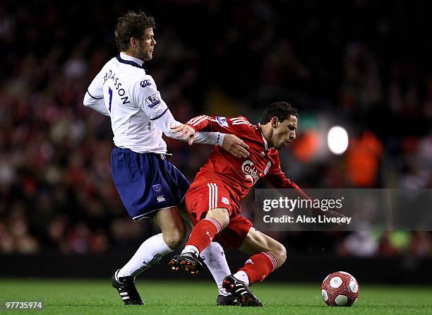 Maxi Rodriguez of Liverpool tangles with Hermann Hreidarsson of Portsmouth during the Barclays Premier League match between Liverpool and Portsmouth...