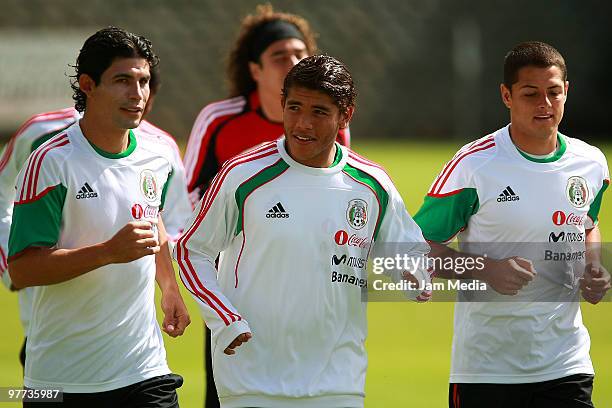 Mexico national soccer team players Jonny Magallon , Jonathan dos Santos and Javier Hernandez exercise during a training session at Mexican Soccer...