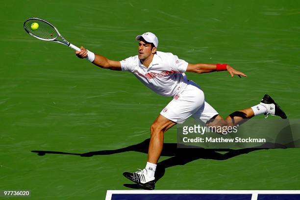 Novak Djokovic of Serbia lunges for a shot against Philipp Kohlschreiber of Germany during the BNP Paribas Open on March 15, 2010 at the Indian Wells...