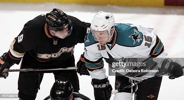 Bobby Ryan of the Anaheim Ducks talks to Dany Heatley of the San Jose Sharks as they wait for a face off during the game on March 14, 2010 at Honda...