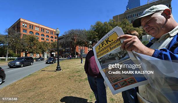Man reads a J.F.K. Special edition newspaper on March 13, 2010 at the spot in front of the former Texas School Book Depository Building in Dealey...