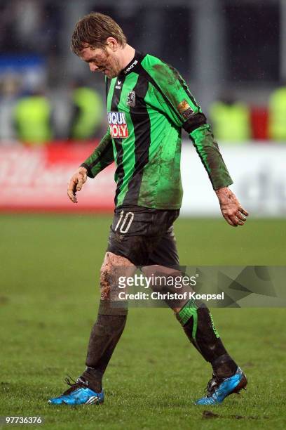Sascha Roesler of Muenchen is very muddy during the second Bundesliga match between MSV Duisburg and 1860 Muenchen at the MSV Arena on March 15, 2010...
