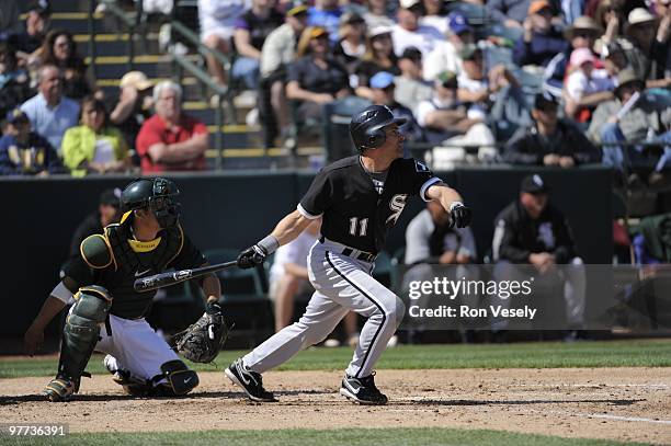 Omar Vizquel of the Chicago White Sox bats during a spring training game against the Oakland Athletics on March 10, 2010 at Phoenix Municipal Stadium...