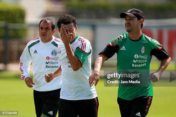 Mexico national soccer team players Cuauhtemoc Blanco , Miguel Sabah and the assistant coach Manuel Vidrio exercise during a training session at...