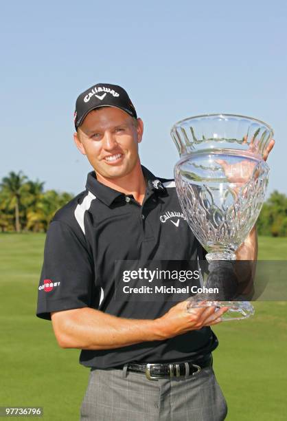 Derek Lamely holds the trophy after winning the Puerto Rico Open presented by Banco Popular at Trump International Golf Club held on March 15, 2010...